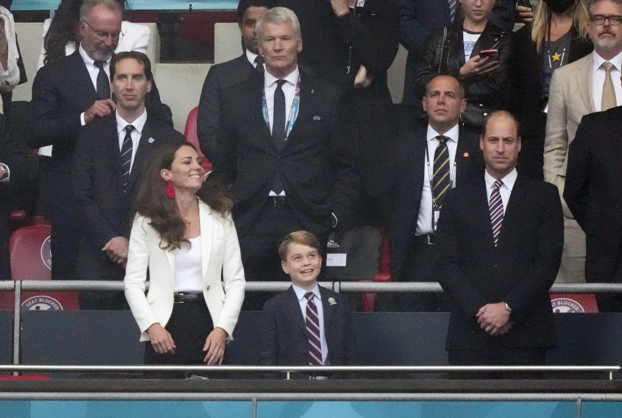 Soccer Football - Euro 2020 - Final - Italy v England - Wembley Stadium, London, Britain - July 11, 2021 Britain's Prince William, Catherine, Duchess of Cambridge and Prince George in the stands before the match Pool via REUTERS/Frank Augstein