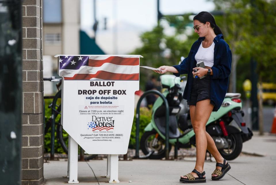 <span class="caption">A massive shift to mail-in voting will be hard for many of the state and local officials who run elections.</span> <span class="attribution"><a class="link " href="https://www.gettyimages.com/detail/news-photo/woman-drops-off-her-main-in-ballot-outside-the-denver-news-photo/1223643499?adppopup=true" rel="nofollow noopener" target="_blank" data-ylk="slk:Michael Ciaglo/Getty Images;elm:context_link;itc:0;sec:content-canvas">Michael Ciaglo/Getty Images</a></span>