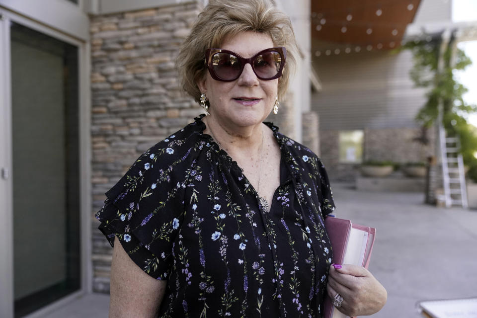Republican voter Diane Hamilton, who works in software sales comments outside the Old Town Newhall Library in Santa Clarita, Calif., on Aug. 2, 2023. She said she has long been suspicious of Hunter Biden's financial and business dealings. In 2020, the contents of a laptop that he'd left at a Delaware repair shop and never retrieved made their way to Republicans and were publicly leaked, revealing messages about his work and personal life. Democrats, she said, had tried to push questions about the laptop "under the rug." (AP Photo/Damian Dovarganes)