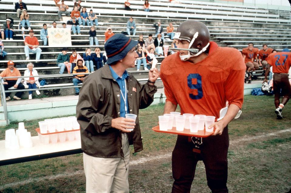 A bullied college waterboy (Adam Sandler, with Henry Winkler) finally gets in the game as a football wunderkind in "The Waterboy."
