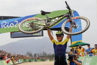 <p>Jenny Rissveds of Sweden celebrates after winning the women’s cross-country mountain bike race at the 2016 Summer Olympics in Rio de Janeiro, Brazil, Saturday, Aug. 20, 2016. (AP Photo/Patrick Semansky) </p>