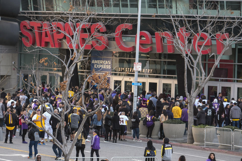 Fans line up to get into the Staples Center to attend a public memorial for former Los Angeles Lakers star Kobe Bryant and his daughter, Gianna, in Los Angeles, Monday, Feb. 24, 2020. (AP Photo/Ringo H.W. Chiu)