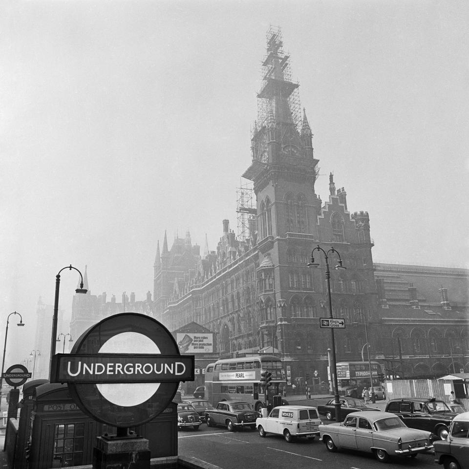 St Pancras Station, London, 1960-1972. View looking towards St Pancras Station from a busy Euston Road with the Underground sign in the foreground. The station clocktower is covered in scaffolding. (Photo by English Heritage/Heritage Images/Getty Images)  - Getty