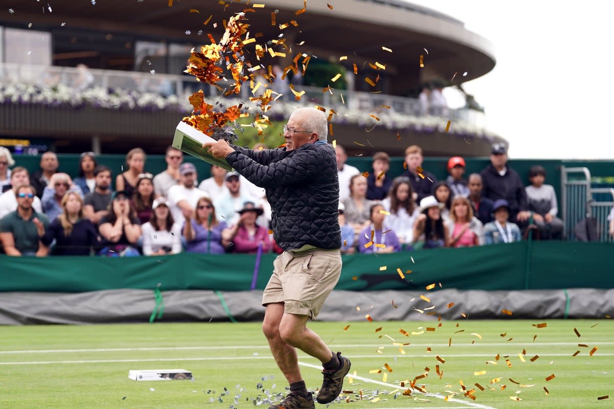 A Just Stop Oil protester at Wimbledon on Wednesday (PA) (PA Wire)