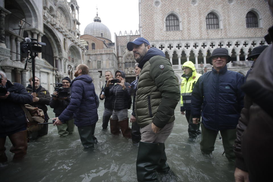 The League leader Matteo Salvini walks in a flooded St. Mark's Square at Venice, Italy, Friday, Nov. 15, 2019. The high-water mark hit 187 centimeters (74 inches) late Tuesday, Nov. 12, 2019, meaning more than 85% of the city was flooded. The highest level ever recorded was 194 centimeters (76 inches) during infamous flooding in 1966. (AP Photo/Luca Bruno)
