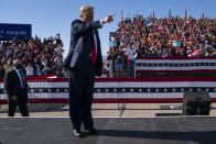 President Donald Trump gestures to supporters as he arrives for a campaign rally at Phoenix Goodyear Airport, Wednesday, Oct. 28, 2020, in Goodyear, Ariz. (AP Photo/Evan Vucci)