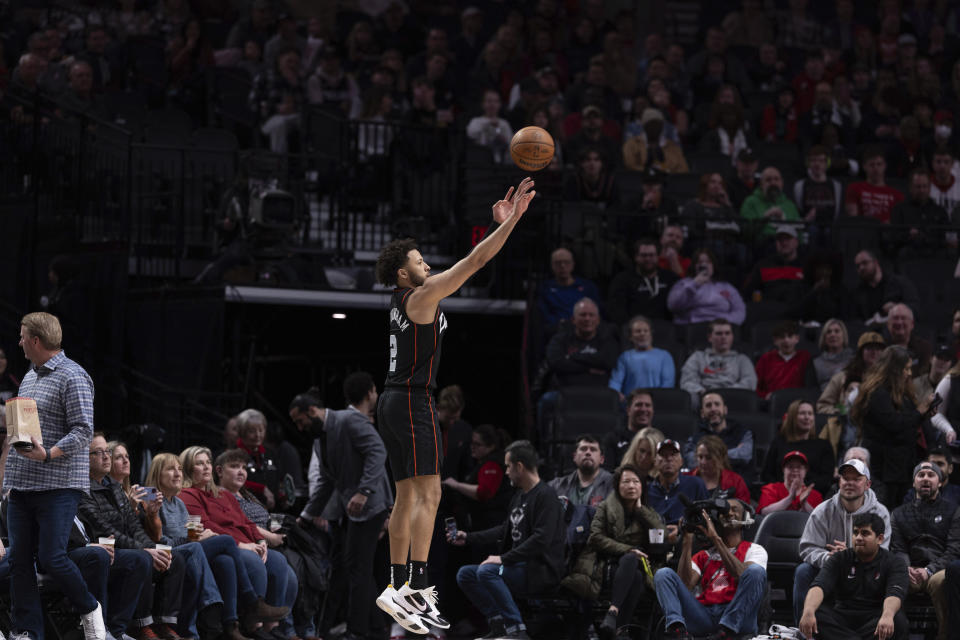 Detroit Pistons guard Cade Cunningham shoots during the first half of an NBA basketball game against the Portland Trail Blazers, Thursday, Feb. 8, 2024, in Portland, Ore. (AP Photo/Howard Lao)