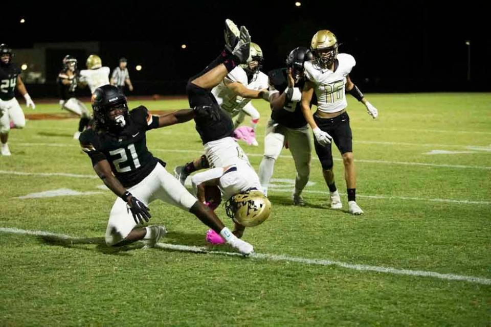 Oct. 14, 2022, Goodyear, Arizona, USA; Desert Edge junior safety Aundre Gibson (21) successfully tackles a Verrado player.