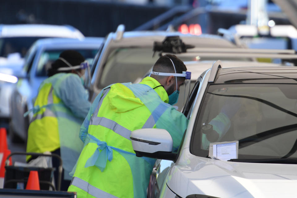 People queue in their cars to get tested for COVID-19 at a pop-up testing clinic at Bondi Beach in Sydney Friday, June 25, 2021. Parts of Sydney will go into lockdown late Friday after a coronavirus outbreak in Australia’s largest city continued to grow. (Dean Lewins/AAP Image via AP)