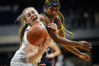 Butler forward Ellen Ross, left, is fouled by Connecticut forward Aaliyah Edwards in the first half of an NCAA college basketball game in Indianapolis, Wednesday, Jan. 12, 2022. (AP Photo/AJ Mast)