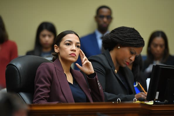 US Congresswoman Alexandria Ocasio-Cortez(D-NY) listens as Michael Cohen, attorney for President Trump, testifies before the House Oversight and Reform Committee in the Rayburn House Office Building on Capitol Hill in Washington, DC on Feb. 27, 2019. | Mandel Ngan—AFP/Getty Images