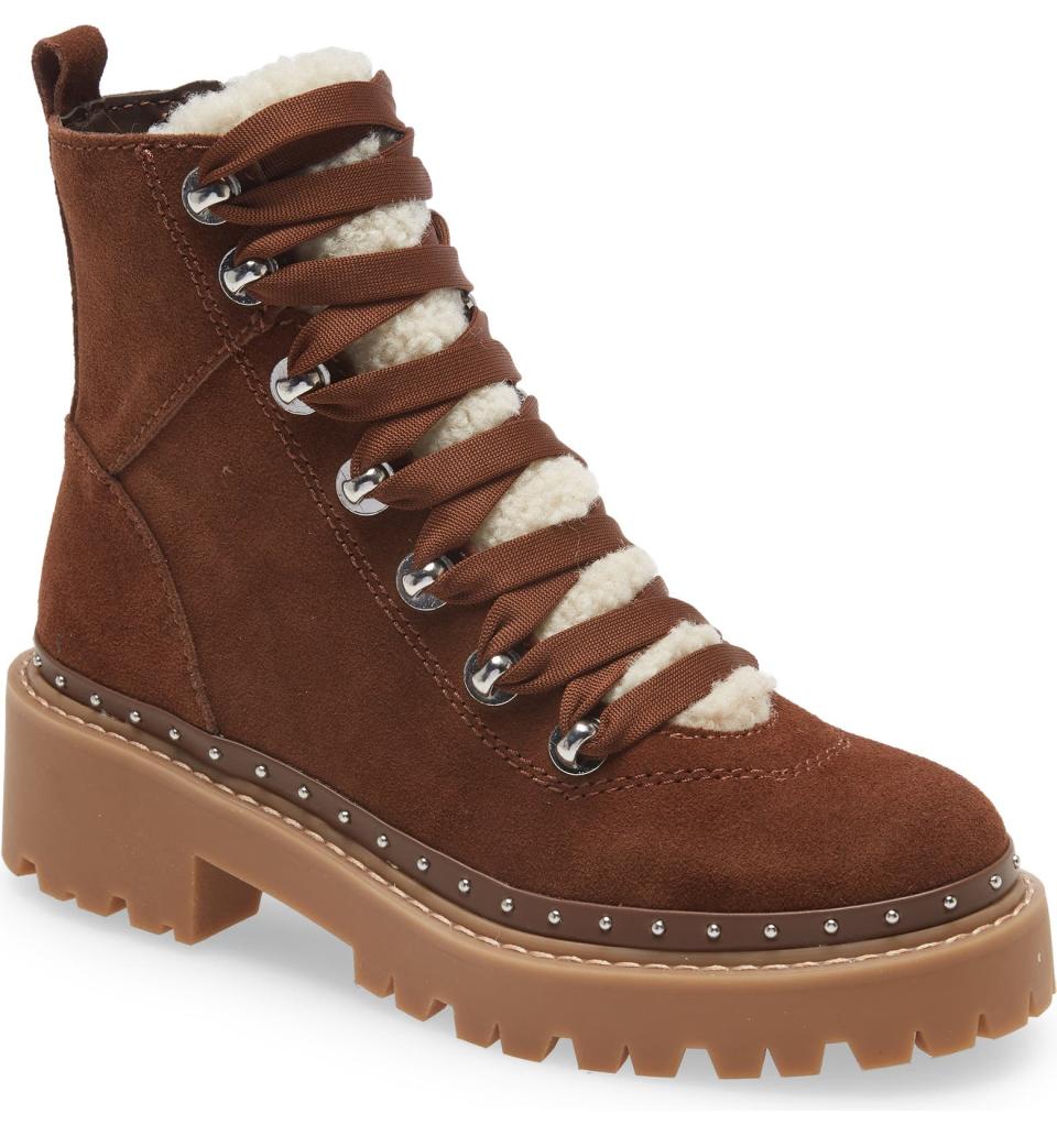 Brown boots with platform sole and shearling tongue.