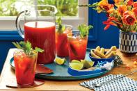 <p>Making <a href="https://www.southernliving.com/recipes/southern-living-bloody-mary-recipe" rel="nofollow noopener" target="_blank" data-ylk="slk:bloody Marys;elm:context_link;itc:0;sec:content-canvas" class="link ">bloody Marys</a> for a big crowd doesn’t mean you have to spend your whole brunch or tailgate playing bartender for everyone. Our <a href="https://www.southernliving.com/drinks/big-batch-summer-cocktails" rel="nofollow noopener" target="_blank" data-ylk="slk:big-batch recipe;elm:context_link;itc:0;sec:content-canvas" class="link ">big-batch recipe</a> makes enough for 10 people and frees you up to enjoy the party. Set out these Big-Batch Bloody Marys in a large punch bowl or glass dispenser with your choice of garnishes next to glasses and a bucket of ice and let everyone help themselves. Even better, you can make this cocktail ahead. You can prepare the mixture up to two days in advance and store in an airtight container in the refrigerator; reserve the vodka and stir it in before serving.</p> <p><a href="https://www.myrecipes.com/recipe/big-batch-bloody-marys" rel="nofollow noopener" target="_blank" data-ylk="slk:Big-Batch Bloody Marys Recipe;elm:context_link;itc:0;sec:content-canvas" class="link ">Big-Batch Bloody Marys Recipe</a></p>