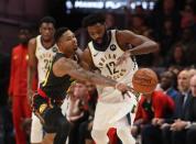 Dec 26, 2018; Atlanta, GA, USA; Atlanta Hawks guard Kent Bazemore (24) tries to steal the ball away from Indiana Pacers guard Tyreke Evans (12) in the second half at State Farm Arena. Mandatory Credit: Jason Getz-USA TODAY Sports
