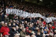 Football Soccer - Liverpool v Sunderland - Barclays Premier League - Anfield - 6/2/16 Liverpool fans hold up signs in protest against ticket prices Reuters / Phil Noble/ Livepic