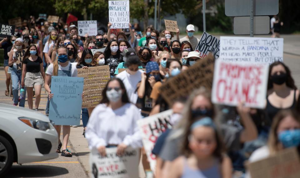 Students march around the Poudre School District's Fort Collins headquarters calling for change in the school district amid the nation's conversation of race and social justice in the wake of George Floyd's death in Fort Collins, Colo. on Monday, June 8, 2020. 