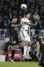 Minnesota United defender D.J. Taylor (27) and Vancouver Whitecaps defender Mathías Laborda (2) attempt a header in the first half of an MLS soccer game Saturday, March 25, 2023, in St. Paul, Minn. (AP Photo/Andy Clayton-King)