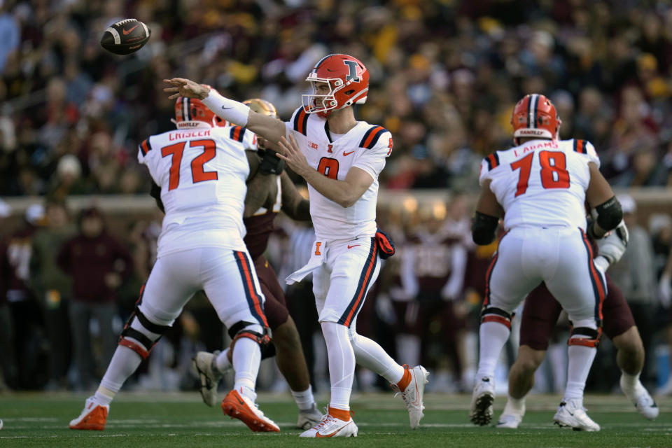 Illinois quarterback Luke Altmyer (9) passes the ball during the first half of an NCAA college football game against Minnesota, Saturday, Nov. 4, 2023, in Minneapolis. (AP Photo/Abbie Parr)