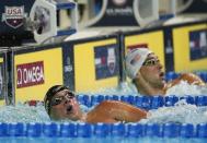 Jul 1, 2016; Omaha, NE, USA; Michael Phelps (right) and Ryan Lochte react after the mens 200 meter individual medley final in the U.S. Olympic swimming team trials at CenturyLink Center. Mandatory Credit: Rob Schumacher-USA TODAY Sports