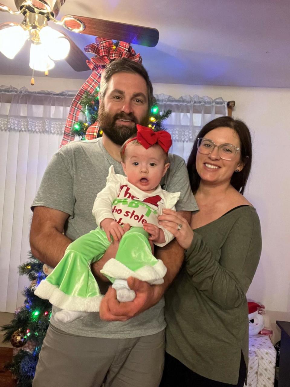 PHOTO: Derek and Amanda Banic are pictured with their daughter Baylor in December 2023. (Courtesy Amanda and Derek Banic)