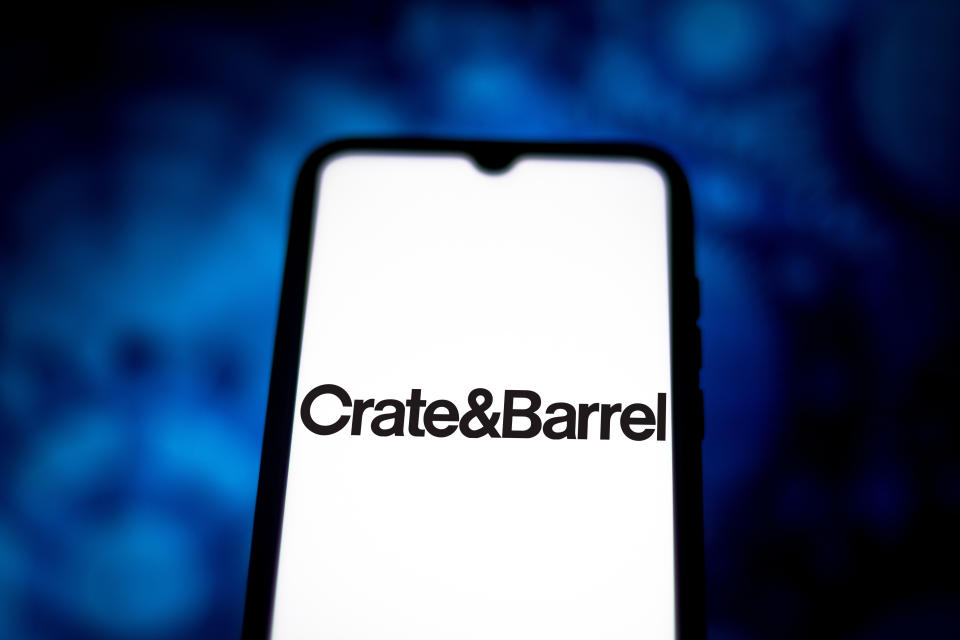 In this photo illustration the Euromarket Designs (Crate & Barrel) logo seen displayed on a smartphone.