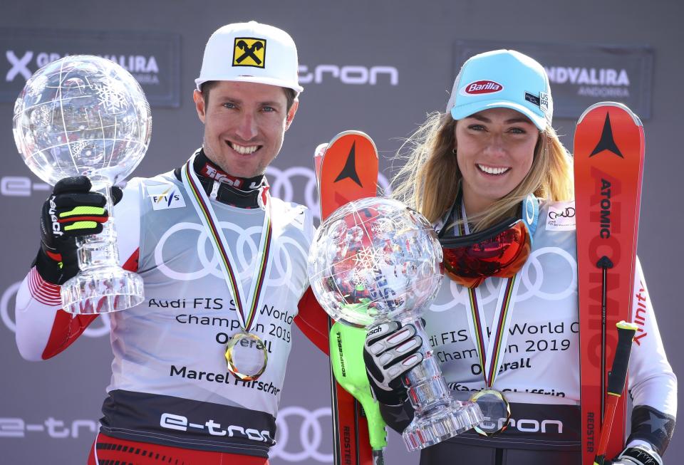 Austria's Marcel Hirscher, left, and United States' Mikaela Shiffrin hold the World Cup overall trophies, at the alpine ski finals in Soldeu, Andorra, Sunday, March 17, 2019. (AP Photo/Alessandro Trovati)