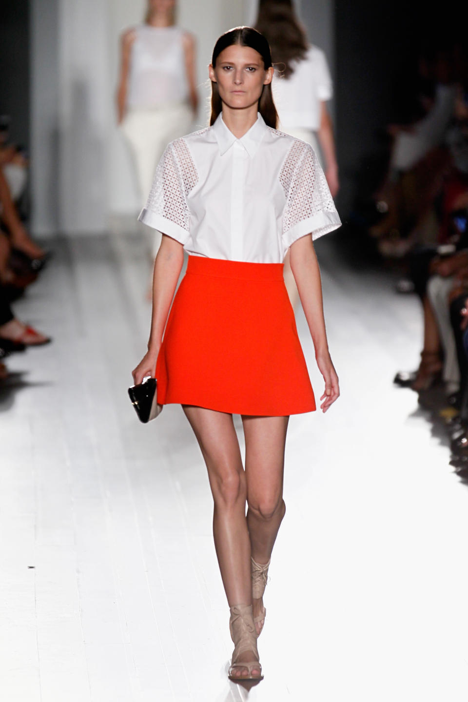 <p>For SS13, Victoria Beckham eschewed her famed love of the heel in favour of pastel-hued gladiator sandals and buckled loafers. Boxy shirts were tucked into primary red skirts and a miniscule wallet was all we needed. <em>[Photo: Getty] </em> </p>