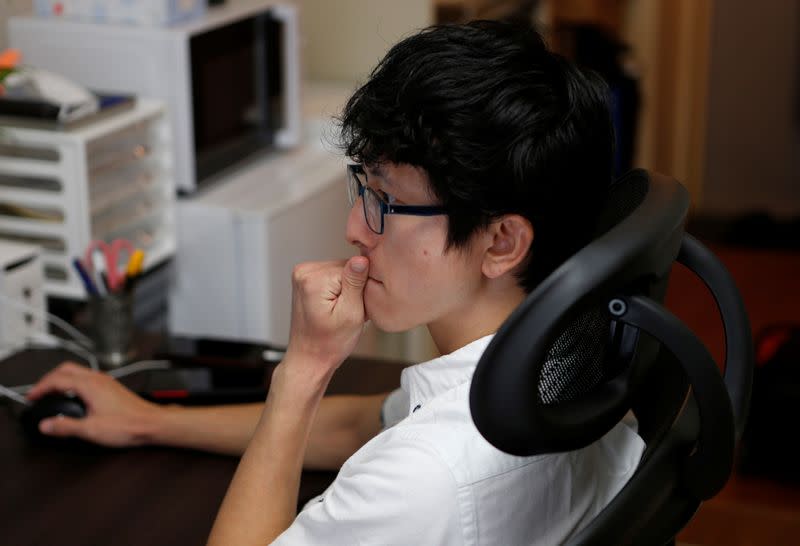 Former Japanese Olympic Trampolinist Tetsuya Sotomura works in his office amid the coronavirus disease (COVID-19) pandemic in Saitama