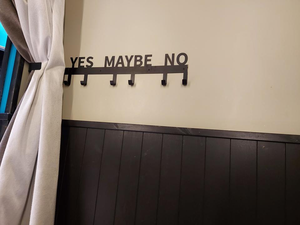 A hanger saying "Yes Maybe No"