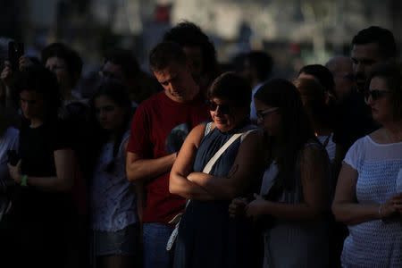 People gather at an impromptu memorial where a van crashed into pedestrians at Las Ramblas in Barcelona, Spain, August 20, 2017. REUTERS/Susana Vera