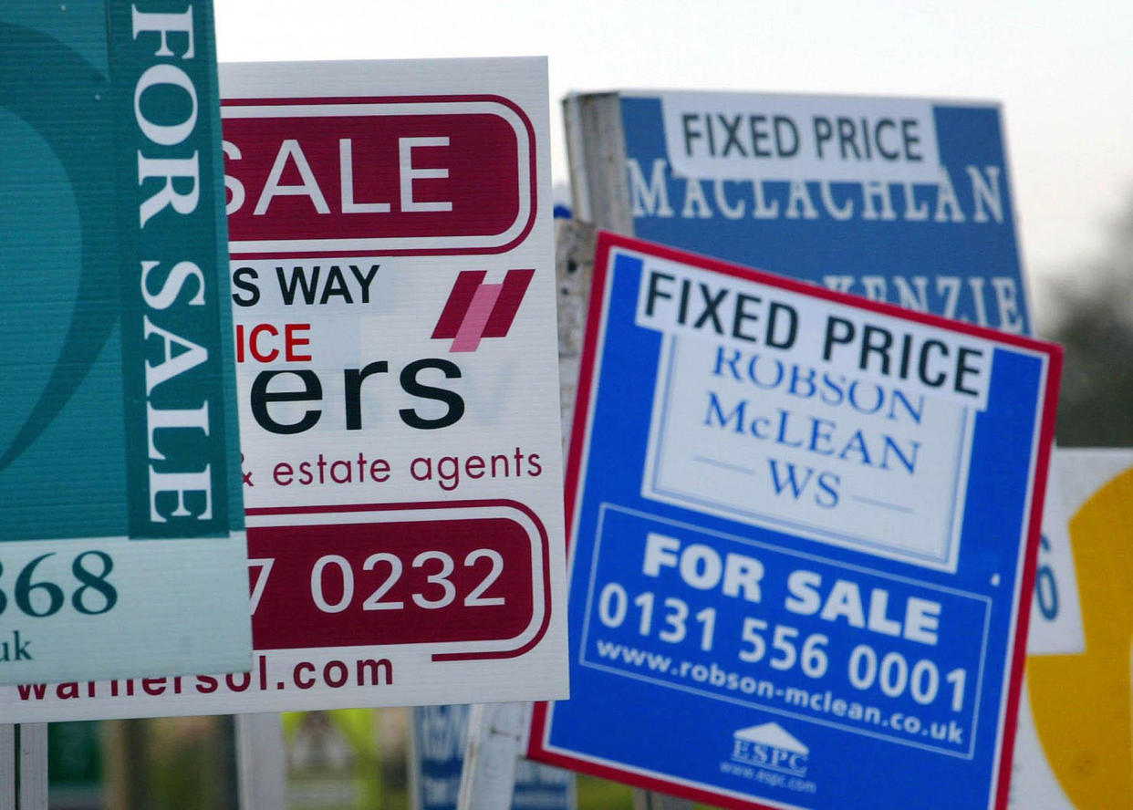 For sale signs outside homes in a street in Loanhead near Edinburgh. Property prices in Scotland continue to rise and Scotland's house price inflation remains above the UK average.