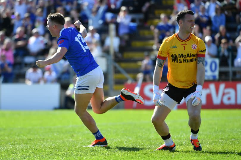 Cavan's Cian Madden wheels away after beating Niall Morgan early in the first half