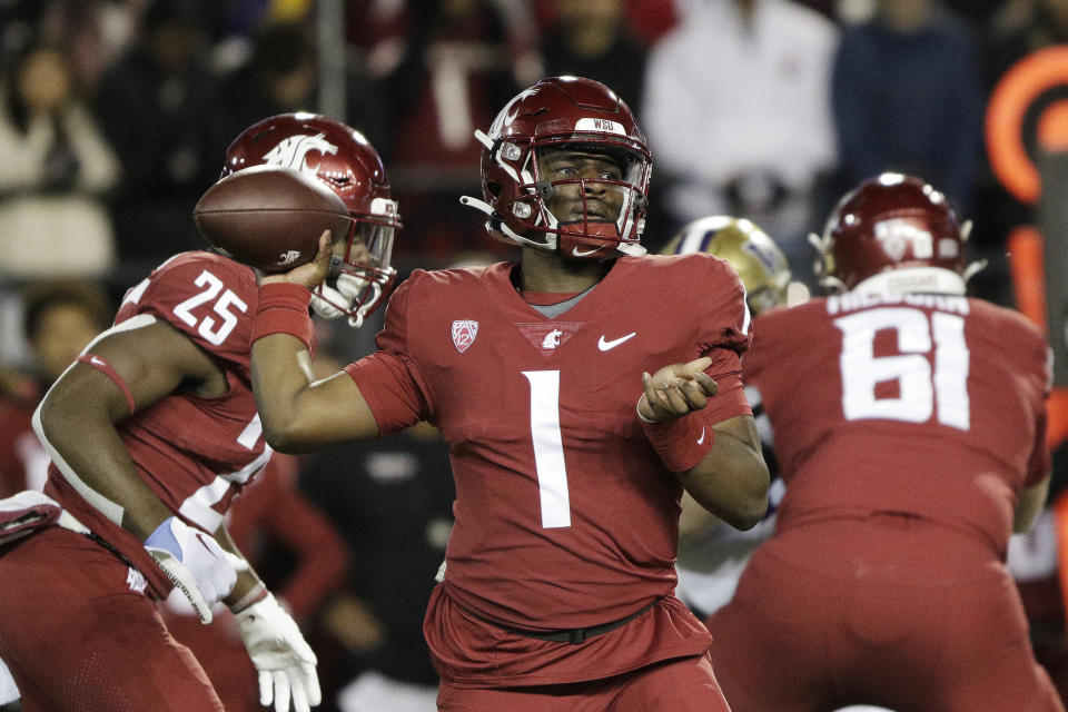 Washington State quarterback Cameron Ward (1) throws a pass during the first half of an NCAA college football game against Washington, Saturday, Nov. 26, 2022, in Pullman, Wash. (AP Photo/Young Kwak)