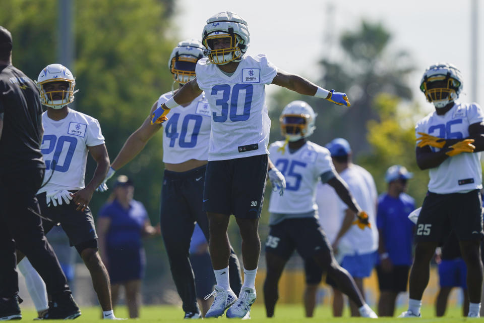 Los Angeles Chargers running back Austin Ekeler (30) jumps while warming up during the NFL team's training camp, Wednesday, July 26, 2023, in Costa Mesa, Calif. (AP Photo/Ryan Sun)