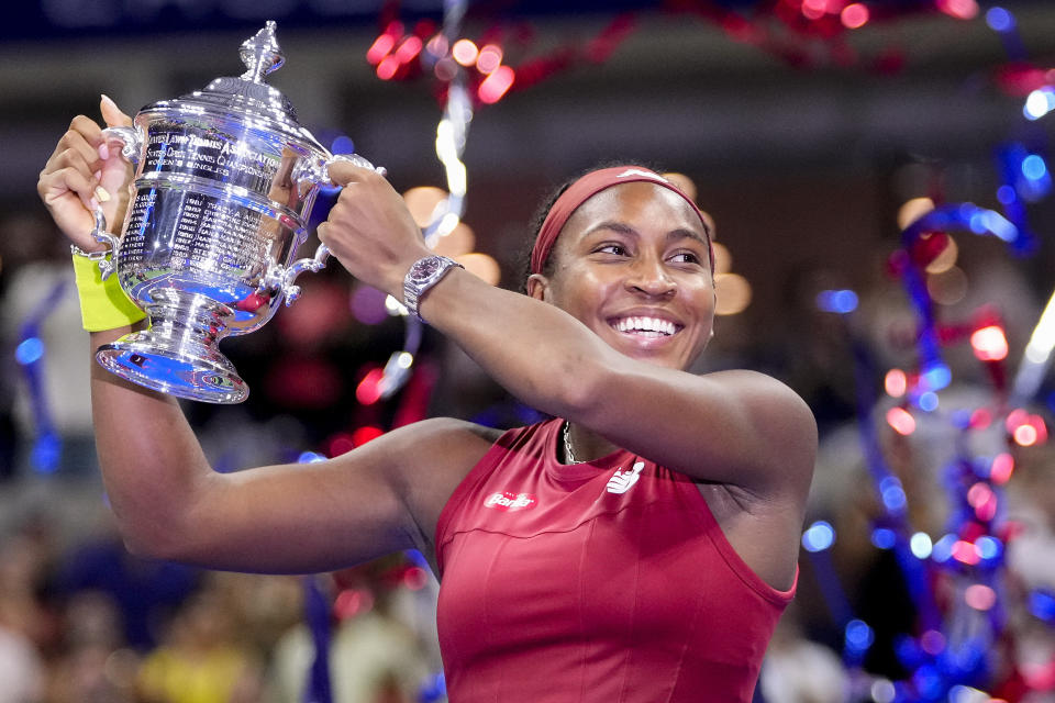 Coco Gauff, of the United States, holds up the championship trophy after defeating Aryna Sabalenka, of Belarus, in the women's singles final of the U.S. Open tennis championships, Saturday, Sept. 9, 2023, in New York. (AP Photo/Frank Franklin II)