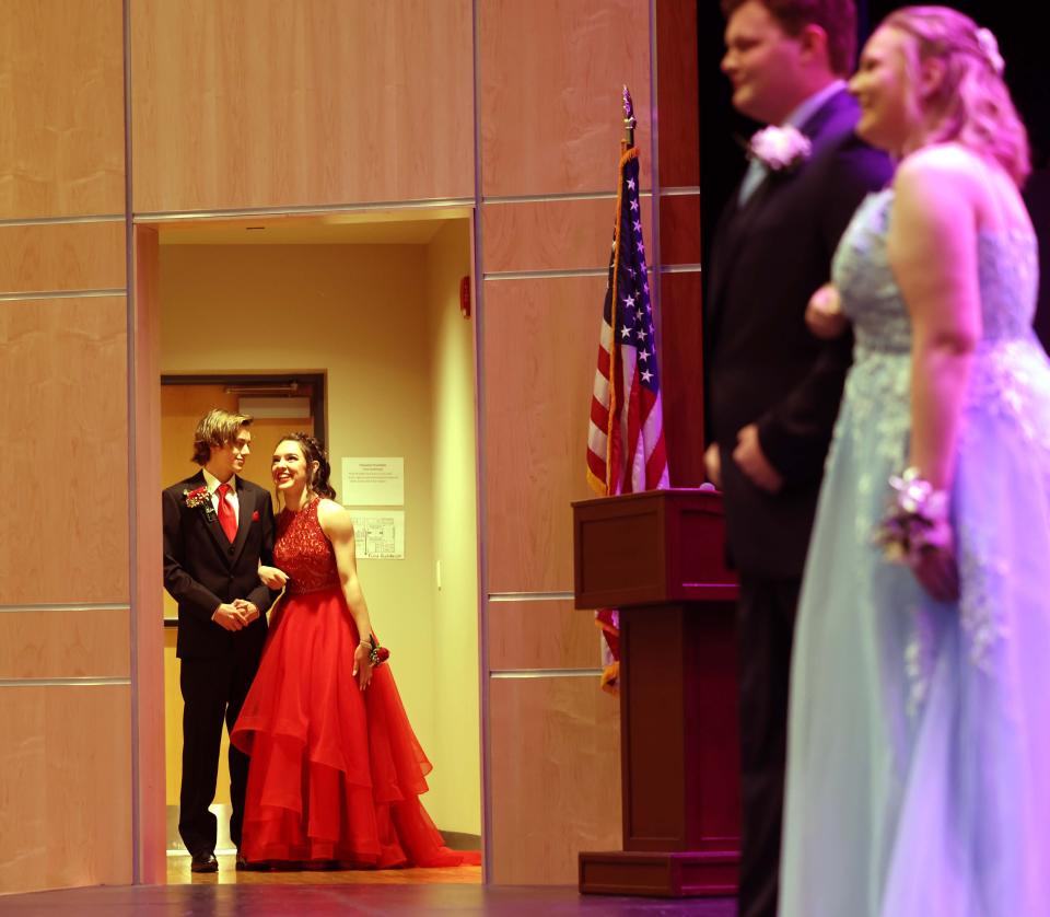 Abington High School seniors participate in the grand prom march into the auditorium on Thursday, April 14, 2022.