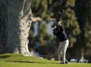 Bubba Watson hits his second shot on the first hole during the Genesis Invitational pro-am golf event at Riviera Country Club, Wednesday, Feb. 17, 2021, in the Pacific Palisades area of Los Angeles. (AP Photo/Ryan Kang)