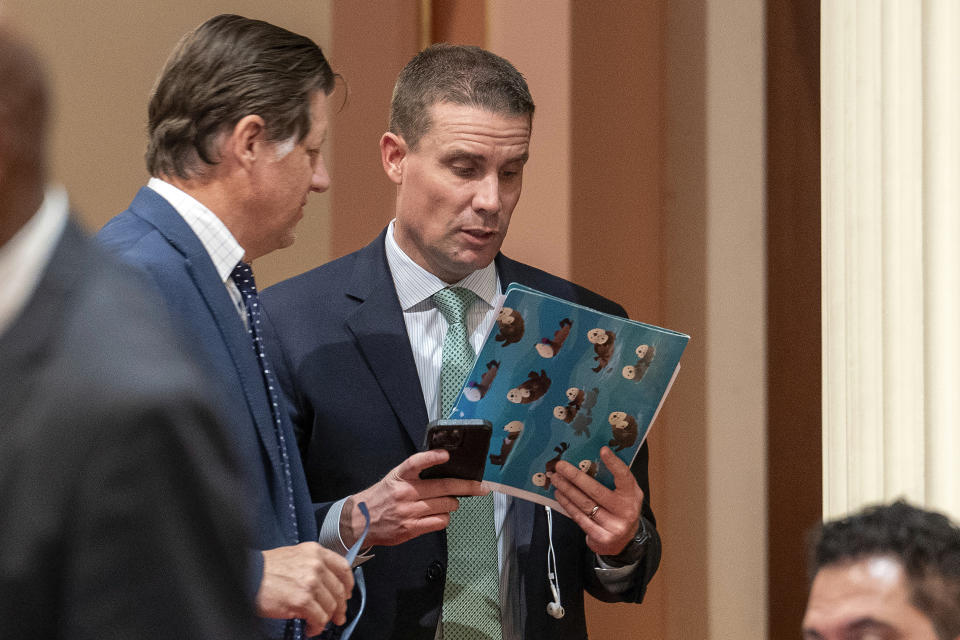 State Senate Republican Leader Brian Jones, left, of San Diego County, talks with State Senate President Pro Tempore Designate Mike McGuire, of Healdsburg, during the Senate session at the Capitol in Sacramento, Calif., Monday Jan. 22, 2024. McGuire will replace current Senate Pro Tempore Toni Atkins when he is sworn-in Monday Feb. 5, 2024. (AP Photo/Rich Pedroncelli)