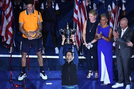 Sep 9, 2018; New York, NY, USA; Novak Djokovic of Serbia poses with the championship trophy after defeating Juan Martin Del Potro of Argentina in the men's final on day fourteen of the 2018 U.S. Open tennis tournament at USTA Billie Jean King National Tennis Center. Mandatory Credit: Danielle Parhizkaran-USA TODAY Sports