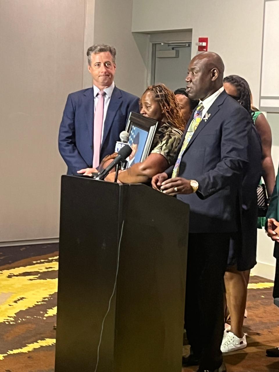 Meka Fortson, the mother of Senior Airman Roger Fortson, cradles a photo of her son as she and her attorneys, Ben Crump and Brian Barr, call for transparency around the circumstances of her son's death in an officer-involved shooting at his apartment Friday, May 3, 2024.