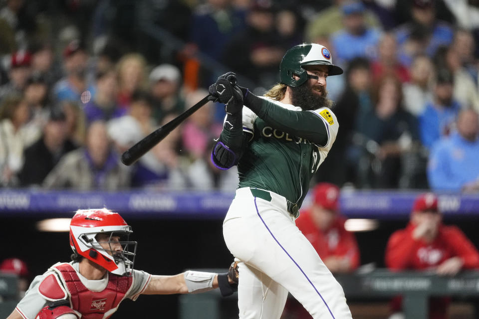 Colorado Rockies' Charlie Blackmon grounds out against the Philadelphia Phillies during the fifth inning of a baseball game Saturday, May 25, 2024, in Denver. (AP Photo/David Zalubowski)