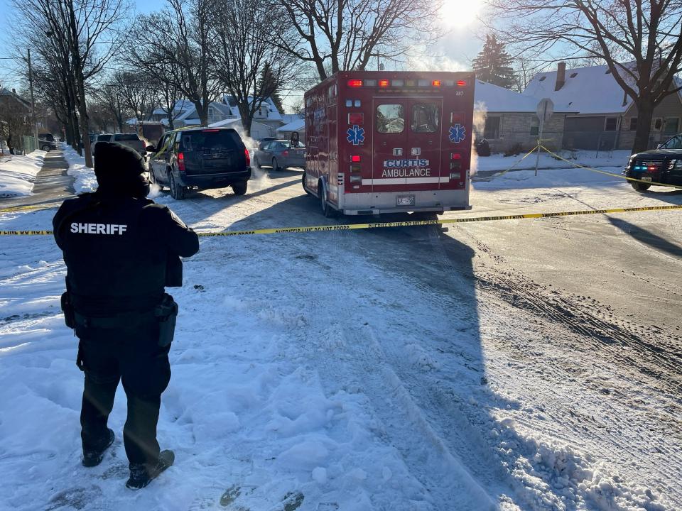 Officials investigate the scene at West Dixon and North 67th streets. A Milwaukee County sheriff’s deputy was shot multiple times early Wednesday during a traffic stop investigation.