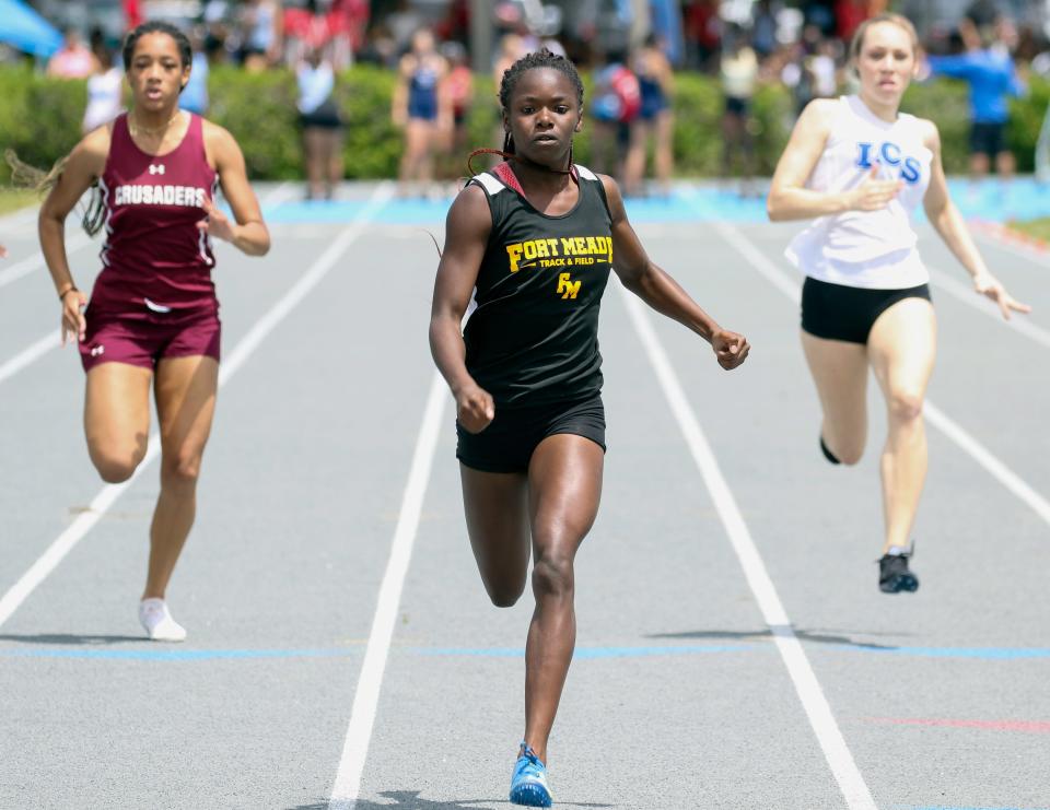 Fort Meade's Azaria Whitehurst wins the 100 on Saturday at the Class 1A, District 10 girls track and field meet. She also won the 200.