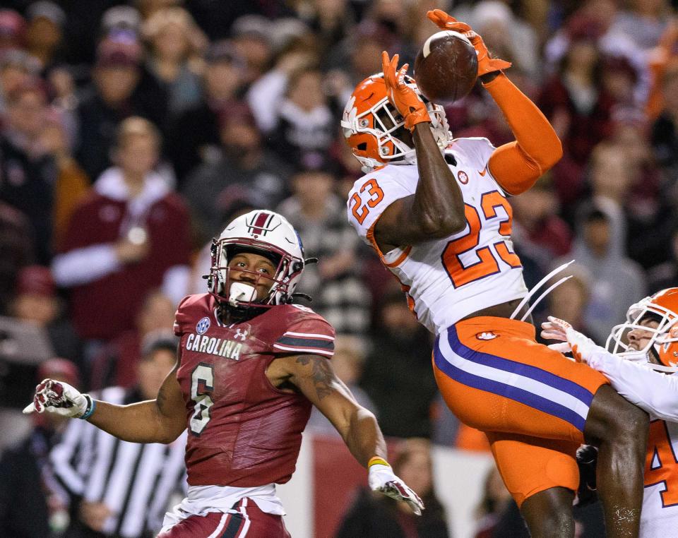 Clemson Tigers cornerback Andrew Booth Jr. (23) makes an interception in the second quarter of the game against the South Carolina Gamecocks at Williams-Brice Stadium, in Columbia on November 27, 2021.