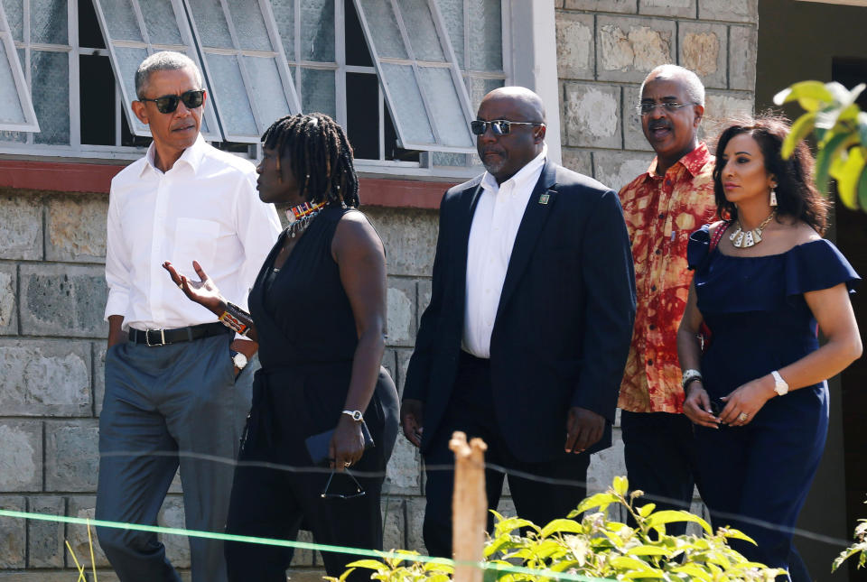 <p>Former U.S. President Barack Obama listens to Auma Obama as he tours the Sauti Kuu resource centre near his ancestral home in Nyangoma Kogelo village in Siaya county, western Kenya July 16, 2018. (Photo: Thomas Mukoya/Reuters) </p>