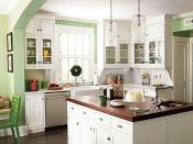 <p>In this North Carolina family home, a classy coat of <a href="https://www.benjaminmoore.com/en-us/paint-colors/color/hc-118/sherwood-green" rel="nofollow noopener" target="_blank" data-ylk="slk:Sherwood Green (HC-118);elm:context_link;itc:0;sec:content-canvas" class="link ">Sherwood Green (HC-118)</a>, by Benjamin Moore pairs perfectly with timeless details like crisp white cabinetry and a mahogany-topped island. </p>