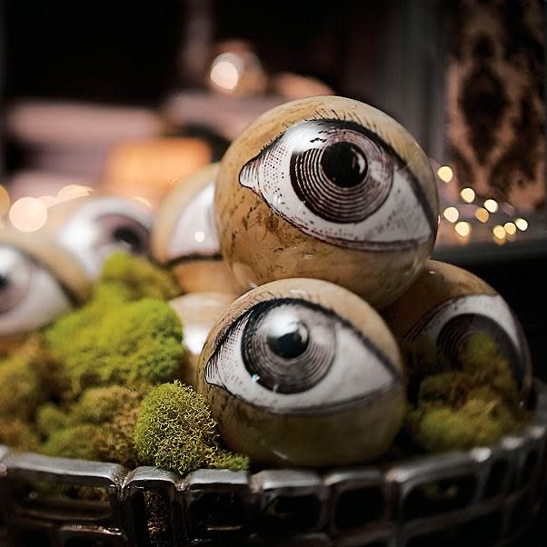 <p>Tell your guests when they arrive that you’ll “be keeping an eye on them” and let ‘em freak out when they see these terrifying orbs.</p> <p><strong>Shop now:</strong> Grandin Road Eyeball Orbs, Set of 8, $29. <span>grandinroad.com</span></p>