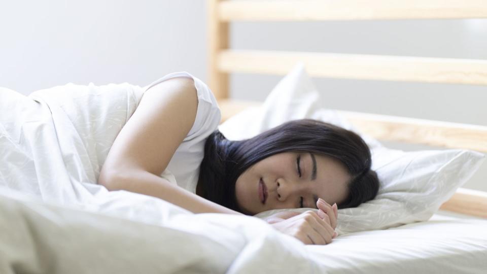 woman sleeping on the bed in the bedroom