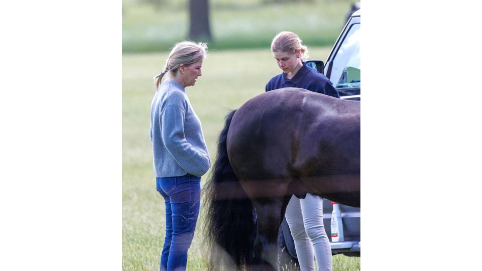 Lady Louise Windsor and Duchess Sophie and a horse looking serious chatting