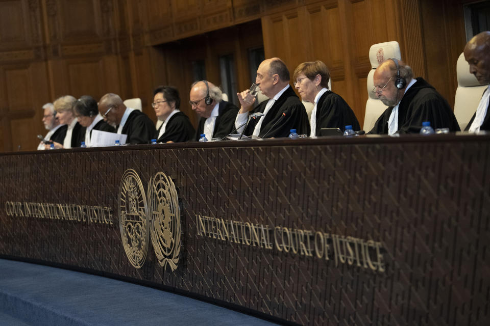 Presiding judge Joan Donoghue, third right, enters the World Court in The Hague, Netherlands, Thursday, July 13, 2023, where the United Nations' highest court delivers its judgment in a long-running maritime border dispute between Nicaragua and Colombia. (AP Photo/Peter Dejong)